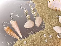 Beautiful collection of earrings handmade with real sea shells! Perfect for this summer beach season, each set is truly unique. These earrings are very lightweight and nickel-free - your ears will thank you! Great for everyday casual accessorizing or dressing up so you can wear a piece of the ocean. No two shells are exactly identical, so these shells were carefully paired together for the best matches. These beachy accessories are a great gift for you, beach lovers, and those who love all things nature made. 🌺 Please select your choice of earring style when purchasing with the dropdown - styles shown and labeled in second photo ☀️ Your choice of silver or gold metal (both nickel-free) 🌊 Waterproof and non-tarnish (can be worn in the ocean!) 🐚 Real seashells - lightweight and delicate, Handmade Shell Summer Jewelry, Handmade Summer Shell Jewelry, Coastal Shell For Summer, Summer Coastal Style Shell, Coastal Style Shell For Summer, Handmade Summer Earrings For Beach Season, Summer Beach Earrings For Gift, Handmade Shell For Summer, Handmade Ocean-inspired Shell For Beach Season