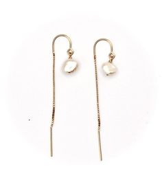 These gorgeous Keshi pearl thread earrings are timeless and classy. They shimmer in the light and match any outfit, about the size of a pea.Available with 14k gold fill ear threads or sterling silver*14K Gold filled metal is highly superior to "gold plated" as it is non-tarnish, can be worn in water, and is hypoallergenic.Want it with regular earwire? Just ask! Delicate Gold Pearl Threader Earrings, Pearl Charm Threader Drop Earrings, Minimalist Pearl Chain Drop Threader Earrings, Minimalist Pearl Chain Threader Drop Earrings, Adjustable Yellow Gold Pearl Drop Earrings, Gold Dangle Pearl Threader Earrings, Gold Pearl Dangle Threader Earrings, Delicate Gold Threader Earrings With Pearl Charm, Classic Gold Threader Earrings With Pearl Drop