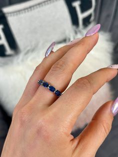 "Details: * Handmade item *Materials: 14k White Gold/ Natural Blue Sapphire Gemstone *Natural Gemstone: Blue Sapphire *Gem color: Royal Blue *Band color: White Gold *Condition: Never been Used; Made to order DESCRIPTION: 💎 Welcome to the Our Shop, Congratulations 🍾 on discovering us. 💎 The Royal Blue Sapphire eternity band from our \"Gem Candy Collection\" is a breathtaking display of elegant design and high-quality gemstones. The quality of the material is second to none and the stones are o Sapphire Ring Band, Blue Gemstone Eternity Band In Fine Jewelry Style, Oval Diamond Cut Eternity Band, Oval Diamond-cut Lab-created Sapphire Ring, Sapphire Eternity Band Gift, Oval Lab-created Sapphire Ring With Diamond Cut, Sapphire Gemstone Eternity Band, Oval Blue Sapphire Ring With Diamond Cut, Oval Eternity Band As A Gift