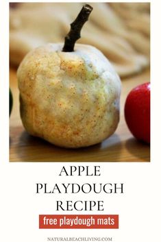 an apple is sitting on top of a wooden table with the words apple playdough recipe