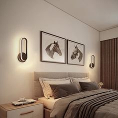 a bedroom with two pictures on the wall