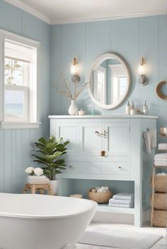 a white bath tub sitting under a bathroom mirror