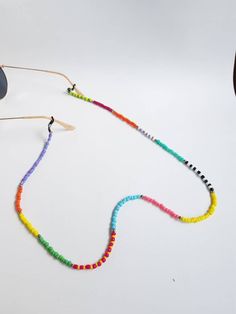 summer beach glasses chain beaded glasses strap eyeglass chain sunglasses strap sunglass holder beaded glass strap sunglasse cord glass cord Handmade eyeglass holder.  The strap is 31 inches long, if you pretend another size please let me know :) Handmade with love :) Multicolor Adjustable Jewelry For Summer, Adjustable Multicolor Beaded Necklaces For Summer, Colorful Beads Glasses Chains As Summer Gift, Summer Glasses Chains With Colorful Beads As Gift, Adjustable Beaded Necklaces For Summer, Black Glasses Chains For Summer Beach, Summer Beaded Chain Glasses Chains As Gift, Summer Beaded Glasses Chain Gift, Summer Beaded Necklaces With Adjustable Chain