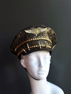 Our captain hat boasts an authentic steampunk aesthetic. Intricate gears, cogs, and spike elements adorn the hat, transporting you to an era of innovation and daring feats.


Age Group/Gender - Adult/Unisex

Size/Type - One size fits all adults

Mask Color - Gold Vintage High Crown Costume Hats For Themed Events, Adjustable Punk Hats For Themed Events, Adjustable Punk Style Hats For Themed Events, Punk Style High Crown Hat For Themed Events, Steampunk Adjustable Hat For Costume Party, Steampunk Costume Hat With High Crown For Costume Party, Steampunk High Crown Costume Hat For Parties, Adjustable Punk Costume Accessories For Themed Events, Adjustable Punk Style Costume Accessories For Themed Events