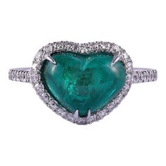 This is part of Chairish’s Fine Jewelry assortment.  Estate heart cabochon Colombian emerald ring. This heart ring is crafted in 18 karat white gold featuring a 2.45 carat heart shaped cabochon Colombian emerald. The heart emerald ring has .35 carat total weight of diamond accents and is excellently made. This unique Colombian emerald ring is a size 6.25.  Exact dimensions for this item are unknown.  Please reference the measurements noted in the description above for the best approximate dimensions. Please reach out to the seller under "Ask the Seller" for specific questions regarding the measurements. Heart-cut Emerald Ring For Formal Occasions, Heart Cut Emerald Ring For Formal Occasions, Formal Heart Cut Emerald Ring, White Gold Heart Cut Emerald Ring, Formal Heart Cut Emerald Ring With Gemstone, Fine Jewelry Platinum Heart-shaped Rings, Fine Jewelry Platinum Heart Rings, Fine Jewelry Heart-shaped Platinum Rings, Heart Cut Emerald Ring With Prong Setting