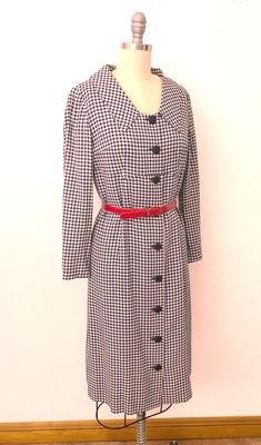 "Vintage 1960's classic shirtdress. Woven white and navy checkered pattern. Enlarged collar, empire waist with a working buttondown front. Slim darted sleeves. Inside is completely lined with dark navy acetate. Wear belted or not - comes with a red belt. Buttondown front has additional snaps on the waist. Handmade and in excellent pre-worn condition. Best fits a size medium. --- M E A S U R E M E N T S --- Measurements are taken flat and doubled. Fits like medium Bust: 36\" Waist: 34\" Hips: 36\ Classic Fitted Plaid Dress For Fall, Collared Plaid Dress For Work, Plaid Collared Dress For Work, Classic Fitted Plaid Dress, Classic Plaid Dress For Work In Fall, Plaid Long Sleeve Formal Dress, Fitted Plaid Dress For Work, Formal Plaid Long Sleeve Dress, Long Sleeve Plaid Formal Dress