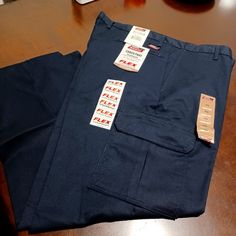 Straight Leg Sits Slightly Below Waist Cargo Pockets Color Navy Blue Size 4230 New. Stretch Blue Pants With Cargo Pockets, Blue Stretch Pants With Cargo Pockets, Blue Straight Leg Work Pants With Pockets, Mid-rise Blue Pants With Side Pockets, Blue Mid-rise Pants With Side Pockets, Blue Cargo Pants For Workwear, Blue Mid-rise Bottoms With Welt Pockets, Navy Full-length Bottoms With Pockets, Blue Straight Leg Work Pants With Cargo Pockets