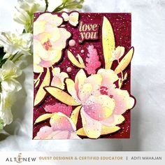 a close up of a greeting card with flowers on it and the words love you