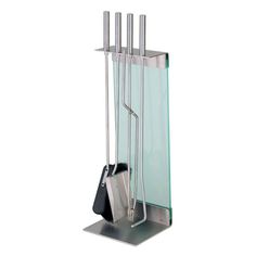 a metal rack with utensils in it on a white background for display purposes