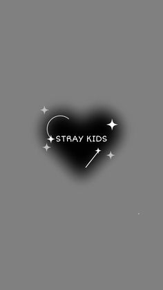 a black heart with the words stray kids written on it and stars in the background