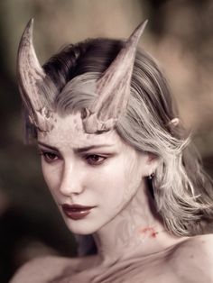 a woman with horns on her head and makeup