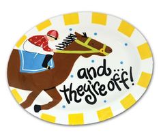 a plate with a horse and jockey on it that says and they're off