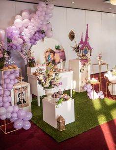 a room filled with balloons and decorations