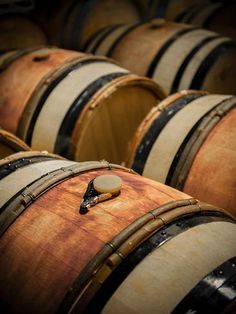 several wooden barrels stacked on top of each other