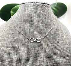 "This is a beautiful stainless steel infinity necklace. Beautiful gift for your wife, girlfriend, daughter, mother, family or friend! The infinity charm is about 1 inch across.  The necklace is non tarnish, hypoallergenic - all stainless steel. Stainless steel infinity necklaces in my shop: https://www.etsy.com/shop/AlwaysPrettyThings?ref=simple-shop-header-name&listing_id=1449458933&search_query=stainless+steel+infinity+necklace See all my stainless steel necklaces: https://www.etsy.com/shop/Al Elegant Hypoallergenic Stainless Steel Necklaces, Elegant Hypoallergenic Stainless Steel Necklace, Minimalist Stainless Steel Jewelry For Mother's Day, Elegant Hypoallergenic Stainless Steel Charm Necklaces, Elegant Stainless Steel Hypoallergenic Charm Necklaces, Elegant Hypoallergenic Stainless Steel Charm Necklace, Hypoallergenic Stainless Steel Necklace For Anniversary, Elegant Stainless Steel Nickel-free Charm Necklace, Adjustable Infinity Stainless Steel Jewelry