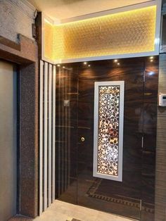 a bathroom with a glass shower door and tiled flooring on the side walk in shower