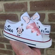 Choose your size  during check out.  Each shoe will have Minnie and your little one's name on the sides and pink polka dot bow on the tongues.  Pink double faced satin ribbon ties to finish off the look. Pink Minnie Mouse Low-top Sneakers, Casual Pink Minnie Mouse Sneakers, Minnie Mouse Converse, Converse Baby, Minnie Mouse Shoes, Ray Ray, 1st Birthday Party For Girls, Girls Shoes Sneakers, 2nd Birthday Party Themes