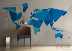 a chair and lamp in front of a wall with an abstract design on it's side