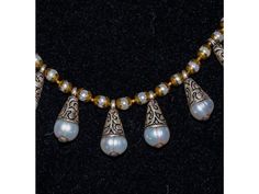 Baroque Freshwater Pearl,  Nepalese Repousse Silver and Brass Necklace Elegant Silver Beaded Temple Necklace, Silver Bohemian Pearl Drop Necklace, Traditional White Teardrop Necklaces, Traditional White Teardrop Necklace, Elegant Silver Beaded Necklace For Ceremonial Use, Elegant Silver Beaded Necklace For Ceremonial Occasions, Celebration Silver Necklace With Pearl Drop, Elegant White Beaded Temple Necklace, Artisan White Jewelry With Bead Caps