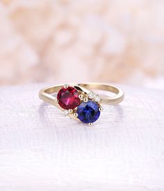 Ruby engagement ring Sapphire engagement ring 14K rose Gold vintage rings woman Wedding Unique Jewelry birthstone Anniversary gift for her All our diamonds are 100% natural and not clarity enhanced or treated in anyway. We only use conflict-free diamonds and gemstones. - Vintage style Ruby and moonstone ring - Natural Conflict free diamonds - comfortable band Lab Ruby Size: 6mm Lab Sapphire Size: 6mm Side sotnes: Natural diamond Weight - approx 0.02CT*3 Clarity - VS-SI Color- H/white Cut - VG - Ruby And Sapphire Engagement Ring, Ruby Sapphire Ring, Diamond Birthstone Ring For Proposal, Valentine's Day Promise Diamond Ring With Birthstone, Mother's Day Anniversary Diamond Ring, Round Cut Birthstone Diamond Ring For Anniversary, Anniversary Birthstone Diamond Ring, Round Cut, Anniversary Birthstone Diamond Ring, Anniversary Ruby Ring Solitaire Round Cut