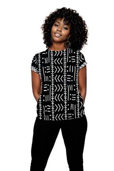 This Tribal Women T-shirt features an authentic African black and white print, perfect for adding a unique touch to any outfit. Made with high-quality material, it offers comfortable wear and stylish design for the modern woman. Celebrate cultural diversity with this one-of-a-kind T-shirt. Product Features Please Compare your Measurements To our Size Chart This T-shirt is Designed for fashionable women. Made from 5.47 Oz. 100% polyester. Double-needle hemmed sleeves and bottom. Vivid print that White Cotton Tops With Unique Print, Trendy Black T-shirt With All Over Print, Casual Black Graphic Print Top, Casual Black Print Top With Graphic Design, White Tops With All Over Print, White Tops With Unique Print, White Cotton Top With Unique Print, Black Crew Neck Top With Fashion Print, Relaxed Fit Crew Neck Top With Fashion Print