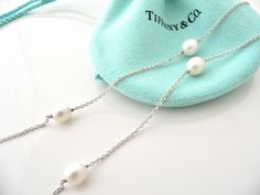 Overview:Offered for sale is a wonderful Tiffany classic. Whether you are just starting your Tiffany collection or are thinking of adding another piece, this one is perfect for you. Tiffany & Co.'s Sterling Silver Pearls by the Yard necklace is a Tiffany classic that will never go out of style. It will most certainly be a piece that you will turn to over and over again, so it is great value for your money! It is a wonderful necklace that fits a lifestyle on the go -- the necklace can be worn Luxury Pearl Necklace With Chain For Gift, Luxury Pearl Necklace With Chain As Gift, Luxury Wedding Jewelry With Cable Chain, Luxury Formal Pearl Necklace With Chain, Formal Pearl Necklace With Chain, Silver Pearls, Go Out, Tiffany & Co., Out Of Style