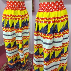 "Vintage 1970s Skirt, this is the perfect handmade boho hippie patchwork skirt. Cool Batik Skirt. This long maxi skirt is made with red and white polka dots print, bright yellow ric rac, panels and triangles, off-white muslin, blue calico print and adorable ladybug ribbon trim. Fun skirt. One of a kind. Unlined. Skirt has hooks at waist and nylon zipper. There are a couple ink marks as shown in photo. Nothing major. Freshly washed  Fits Small  Excellent condition  No Label, appears housemade Measurements are  Waist 26\" Hips 62\" Length 37.5\" Sweep 64\"" Retro Patchwork Skirt For Summer, Retro Patchwork Skirt For Spring, Vintage Long Skirt With Patchwork, Retro Summer Skirt, Retro Summer Pencil Skirt, Retro Cotton Patchwork Skirt, Retro Multicolor Bottoms With Patchwork, Retro Multicolor Patchwork Bottoms, Retro Fitted Patchwork Skirt