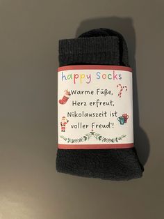 two pairs of happy socks with words on them