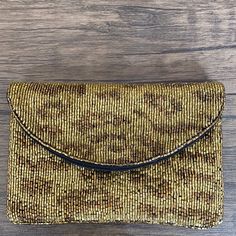 This chic mini clutch features a gold cheetah pattern and a gold strap for a wild and stylish look. Perfect for going out, this clutch bag is a great way to bring your essentials while looking fashionable. Measurements: 7”L x 0.5”W x 5”HChain Strap Measurement: 45” Gold Clutch Shoulder Bag For Night Out, Gold Rectangular Clutch For Fashion Accessory, Gold Evening Bag With Detachable Strap, Trendy Gold Pouch Clutch, Gold Crossbody Clutch For Evening, Elegant Evening Shoulder Bag In Leopard Print, Brown Party Clutch With Detachable Strap, Gold Clutch With Detachable Strap For Everyday Use, Gold Rectangular Clutch With Detachable Strap