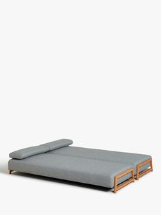 a bed that is sitting on top of a wooden frame