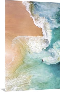 two surfers are riding the waves on their surfboards in the ocean, from above