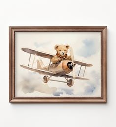 a painting of a teddy bear sitting on top of an old fashioned plane in the sky