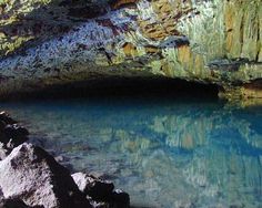 the water is clear and blue in this cave