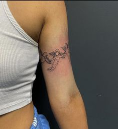 a woman's arm with a tattoo on it that has an image of a bird flying