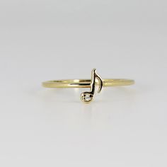 14k Solid Gold, diamond music note ring. Music note diamond stacking ring. DETAILS ABOUT THE RING AND DIAMONDS *** Band is 1.3mm wide 14k solid gold, *** Music note is approx. 8mm long, *** Diamonds are F color, SI clarity scale, 1mm *** Diamond carat is 0,007 ct weight. Diamond is a stone that truly states, “I love you” in a deep way, it is symbol of deep, everlasting love, as well as the fact that it’s the hardest substance known on earth. A diamond is forever. Diamond is birthstone for April. Music Ring, Music Note Ring, Music Note Jewelry, Music Rings, Diamond Music, Diamond Stacking Rings, Gold Ring Designs, Music Notes, Stacking Rings