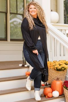 Wrap yourself in warmth with this unique black cardigan! This cutie has a cool design on the shoulders and has a fun split along the front and back! Style this over a tank or cami and skinnies for an easy to wear look! 73% Rayon, 22% Polyester, 5% Spandex Black Stretch Soft Knit Cardigan, Black Soft Knit Stretch Cardigan, Trendy Open Front Knit Top, Black Fall Sweater For Day Out, Black Sweater For Fall Day Out, Trendy Open Front Tops For Fall, Black Cardigan For Fall Loungewear, Black Cardigan For Loungewear And Fall, Black Open Front Top For Fall