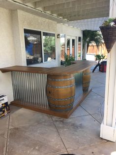 a large wooden barrel sitting on top of a patio