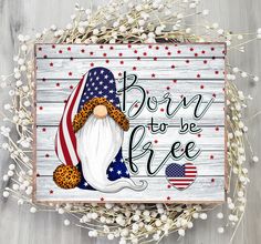 a wooden sign that says born to be free with an image of a santa clause