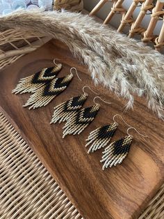 These beaded fringe earrings with black gold ivory gradient are made of high quality Czech beads. They are lightweight and comfortable. These beaded earrings are an amazing gift for special occasions: holidays, birthdays, anniversaries, Christmas, Valentine's Days and more. It can also be jewelry for the bride or bridesmaids at a boho wedding. This pair is a mix of ethnicity and modern casual style. I create for women who love to feel completely different. Colors: black, gold, ivory.   --------- Luxury Gold Bohemian Beaded Earrings, Bohemian Beaded Earrings With Black Beads, Artisan Gold Jewelry With Fringe, Black Beaded Fringe Tassel Earrings For Festival, Gold Bohemian Beaded Earrings With Fringe, Black Bohemian Chandelier Earrings For Festival, Bohemian Black Tassel Earrings With Dangling Beads, Bohemian Gold Beaded Fringe Earrings, Gold Bohemian Beaded Fringe Earrings