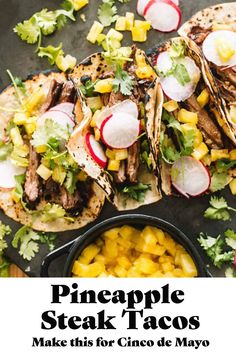 pineapple steak tacos with mango salsa and cilantro on the side in a cast iron skillet