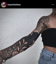 a woman's arm with tattoos on it