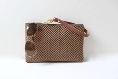 Woven Clutch Bag by Independent Reign Everyday Clutch With Braided Handles, Chic Everyday Clutch With Braided Handles, Chic Clutch With Braided Handles For Everyday, Brown Clutch For Everyday Spring Use, Chic Brown Woven Clutch, Trendy Natural Clutch, Chic Brown Handwoven Clutch, Chic Handwoven Everyday Clutch, Chic Handwoven Clutch For Everyday