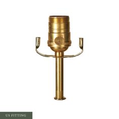 an antique brass candle holder on a white background