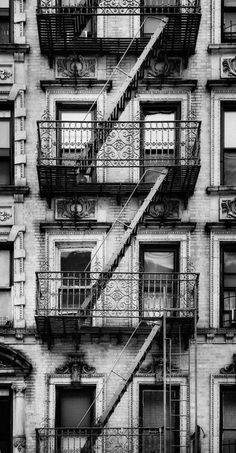 an old building with many balconies and fire escapers on the front door