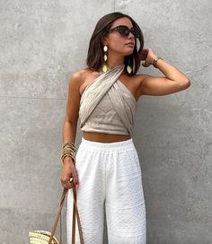 Sleeveless Bandage Tops For Beach, Chic Sleeveless Bandage Crop Top, Beach Sleeveless Bandage Top, Chic Bandage Tank Top For Summer, Summer Stretch Bandage Halter Top, Summer Beach Bandage Top, Summer Bandage Halter Top, Versatile White Halter Top For Summer, Sleeveless Bandage Tops For Summer