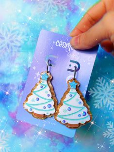 This listing is for ONE Pair of Christmas Tree Sugar Cookie Earrings. Available in Blue, Pink or Mismatched. Hoops are hypoallergenic. If you wish to replace with lever backs or hooks please leave me a note at checkout. Earrings are approximately 2" Snow Flake cookies are a separate listing. Follow me on IG for shop updates! @shopcosmiclovely Subscribe to my newsletter for exclusive coupons! Blue Earrings For Christmas Gift, Snowflake Sugar Cookies, Snowflake Sugar, Cookie Earrings, Tree Cookies, Christmas Tree Cookies, Christmas Sugar Cookies, Snow Flake, Sugar Cookie