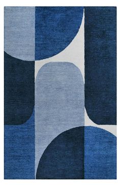 an area rug with blue and white circles on it