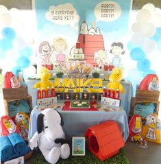 a snoopy themed birthday party with balloons and decorations