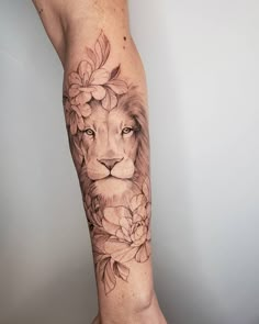 a lion with flowers on his leg