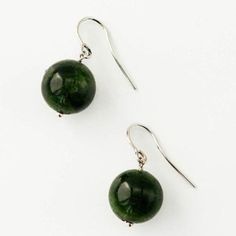 The rich, earthy green of chrome diopside is a true testament to nature's beauty. Found almost exclusively in eastern Siberia, chrome diopside is a rare gem due to the nearly year round frozen conditions. Chrome diopside can only be mined a few months each year! The chrome diopside gemstones are elegantly suspend from a delicate French ear wire, available in your choice of 14k gold or sterling silver. 💎Available in 14K gold (yellow, white, or rose) and sterling silver 💎French wire earring 💎Ch Nickel Free Green Jewelry With Round Stone, Round Tourmaline Gemstone Earrings, Green Tourmaline Jewelry With Natural Stones, Gold-plated Teardrop Clip-on Jewelry, Chrome Diopside Jewelry, Green Jade Earrings For Healing, Dark Green Round Jade Jewelry, Green Tourmaline Earrings For Gift, Nickel-free Green Jewelry With Round Stone